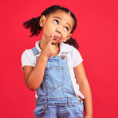 Image showing Child, face or thinking finger on chin on isolated red background in games innovation, question or planning vision. Little girl, kid or curious expression in ideas, fashion clothes or curly hairstyle