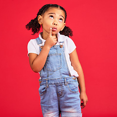 Image showing Kid, face or thinking finger on chin by isolated red background in games innovation, question or planning vision. Little girl, ideas or curious expression for child fashion clothes or curly hairstyle