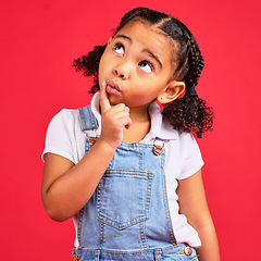 Image showing Little girl, ideas or thinking face by isolated red background in games innovation, question or planning vision. Kid, expression or curious finger on chin, children fashion clothes or curly hairstyle