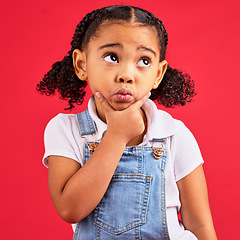 Image showing Kid, ideas or thinking face by isolated red background in games innovation, question or planning vision. Little girl, expression or curious finger on chin, children fashion clothes or curly hairstyle