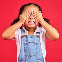 Image showing Child, hands and eyes cover on isolated red background with angry, mad or stubborn facial expression. Girl, kid and youth hiding face in tantrum, autism or adhd for behaviour issue, crisis or problem