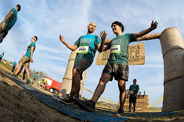 Image showing Athletes crossing the finish line