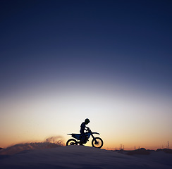 Image showing Silhouette, sport and riding motorcycle against night, sky and background in nature, extreme sports and adrenaline. Biking, motorbike and person driving on dirt road, dark and shadow, stunt and free