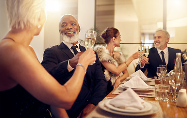 Image showing Man, toast and friends at restaurant party in night for diversity, business executive team and success. New year, celebration talk and people at gala with champagne, congratulations and solidarity