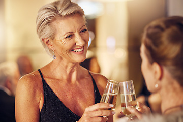 Image showing Success, happy or women toast in a party for goals, winning or new year at luxury social event. Mature, celebration or senior friends cheers with champagne drinks or wine glasses at a fun dinner gala