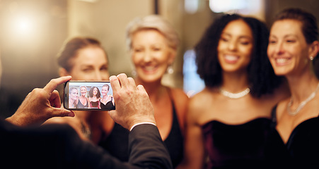 Image showing Phone, photography or friends in a party in celebration of goals or new year at fancy luxury night event. Girls, screen or happy women take pictures for social media at dinner gala or fun birthday