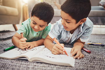 Image showing Kids, brothers and drawing while learning on floor at home, relax and happy while bonding. Children, art and sketch in notebook by siblings having fun in living room, smile and enjoying brotherhood