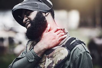 Image showing Man, neck pain and paintball injury holding sore area, joint or inflammation in agony after game or match outdoors. Male soldier player in extreme sport suffering from painful ache or shot during war