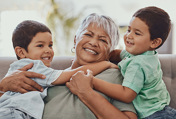 Image showing Love, grandmother and boys on couch, smile and playful on weekend, bonding and loving together. Granny, grandkids and male grandchildren on sofa in lounge and happiness on summer vacation or carefree