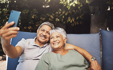 Image showing Relax, smile and senior couple with a selfie on an outdoor couch during retirement holiday in Spain. Happy, communication and elderly man and woman with a photo for a memory, streaming and social app