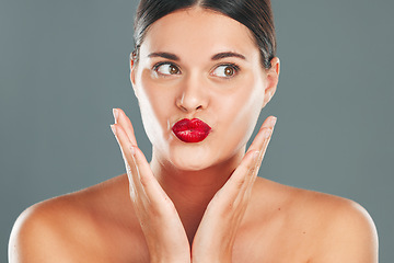 Image showing Woman lips with lipstick, kiss face and makeup with red cosmetics and playful pout isolated on studio background. Healthy skin, beauty and skincare with cosmetic care, wellness and facial glow