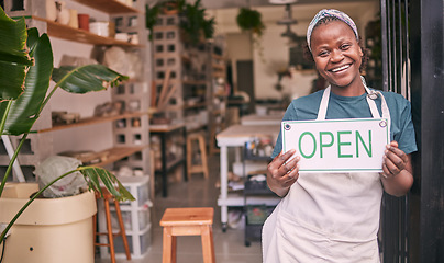 Image showing Creative startup, small business and black woman with open sign for art class, workshop and pottery store. Smile, entrepreneur and girl happy for welcome to ceramic, clay sculpture and retail artwork