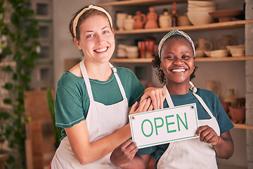 Image showing Small business, pottery and women team with open sign for creative workshop, art studio and startup. Smile, teamwork and entrepreneurs ready for welcome to ceramics, clay sculpture and artwork store