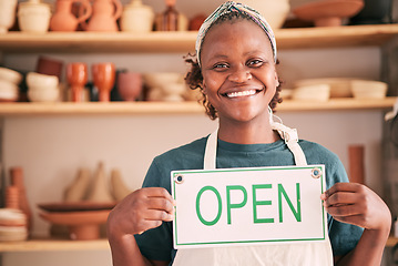 Image showing Small business, pottery and black woman with open sign for creative workshop, art studio and startup. Manager, entrepreneur and girl happy for welcome to ceramics, clay sculpture and artwork store