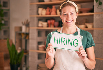 Image showing Hiring sign, portrait and woman business startup in shop recruitment, job advertising and retail experience. Boss, person or employer hand holding a message, banner or board for creative opportunity