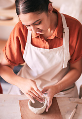 Image showing Ceramic store, pottery or artist design sculpture mold, clay manufacturing or art product. Creative retail service, craft process or startup small business owner, employee or woman in studio workshop