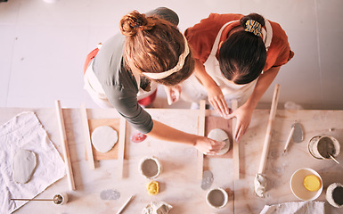 Image showing Pottery class, ceramic workshop and team design sculpture mold, clay manufacturing or art product. Diversity, retail store and top view of startup small business owner, artist or studio women molding