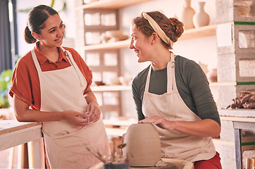 Image showing Pottery studio, workshop and talking women doing sculpture design mold, manufacturing or art product. Creative, vase molding and startup small business owner, employee or friends in ceramic store