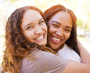 Image showing Young women and friends hug portrait for togetherness at park for bonding, wellness and happiness. Gen z, youth and natural black people with happy smile and embrace on summer hangout in nature.