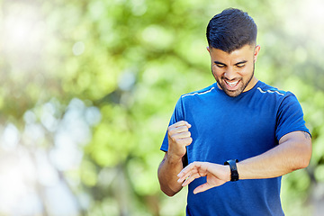 Image showing Exercise, mockup and watch with a man cheering his progress as a runner on a cardio or endurance workout. Fitness, running and health with a male athlete celebrating a target or goal while training