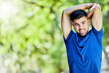 Image showing Portrait, mockup and stretching with a sports man outdoor in nature for a warm up before exercise. Fitness, mock up and training with a male athlete on a natural green background for a workout