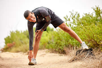 Image showing Stretching legs, exercise and man on nature trail for running, marathon training and cardio workout. Sports, healthy body and portrait of happy male athlete warm up for wellness, exercise and balance