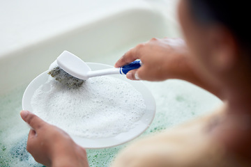 Image showing Cleaning kitchen, soap water and hands of woman cleaner to clean plate with a brush for hygiene. Maid service for washing dishes to wash away bacteria, dirt or virus in house, home or apartment