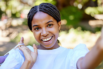 Image showing Black woman, shopping and portrait smile for selfie, social media or post in the outdoor park holding bags. Happy African American female shopper, vlogger or influencer smiling for profile picture