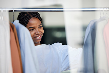 Image showing Shopping, fashion and black woman in store with clothes choice on rack for sale, discount and promotion. Retail, designer boutique and happy girl customer with clothing, outfit and wardrobe products