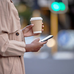 Image showing Phone, hands and black woman with coffee in city, internet browsing or social media. Business mobile, tea and female employee with smartphone for networking, text messaging or web scrolling in town.