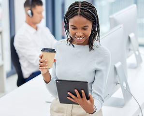 Image showing Call center agent, tablet and office for research, focus and analytics with smile, coffee cup and networking. Customer service, consultant and black woman in tech support, telemarketing and service