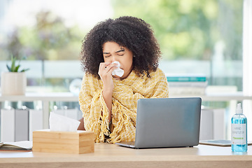 Image showing Sick, laptop and blowing nose with a business back woman using a tissue while working in her office. Computer, covid and sneezing with a young female employee wrapped in a blanket while ill at work