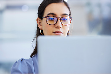 Image showing Business woman, glasses and working on laptop in office, agency and startup company. Focus, face and female worker on computer technology for email, internet planning and professional seo research