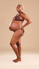 Image showing Black woman, laughing or holding pregnant stomach on studio background in body empowerment, love or baby support. Smile, happy and pregnancy model in body underwear or ready for motherhood on mock up