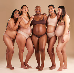 Image showing Pregnant, body and laughing group of women in diversity support, solidarity and community on studio background. Smile, happy or pregnancy friends in underwear, funny or comic joke with stomach growth