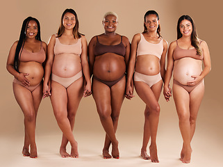 Image showing Pregnant, women or diversity portrait with stomach on studio background in body love, baby or community support. Smile, happy or pregnancy friends in underwear for tummy growth or mothers empowerment