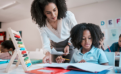 Image showing Math, education or teacher helping a child in a classroom with learning development, growth or studying. Writing, notebook or black woman teaching, talking or speaking to a young African boy student