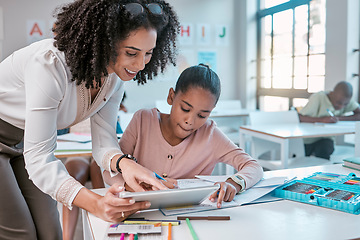 Image showing Female teacher helping young girl, teaching creative work in book and children in sunny classroom. Education empowerment in school, educator speaking to student and learning mathematics at desk