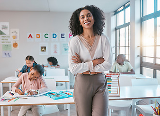 Image showing School teacher, woman portrait and classroom for education, learning and children or students. Happy and confident person teaching kids knowledge, creative art development and writing in a class