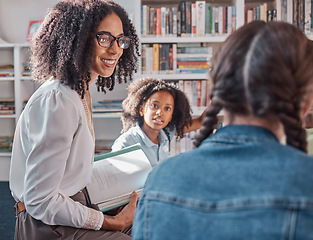 Image showing Teacher, storytelling or children in a library for learning development, reading skills or growth. Happy smile, kids or students listening to a black woman asking for feedback on fun books at school