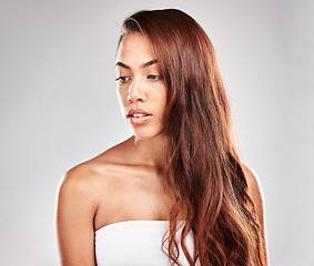 Image showing Woman is thinking with hair, face and beauty, skin and care glow with shine isolated on studio background. Hairstyle, cosmetic skincare and mockup with wellness, keratin treatment and styling