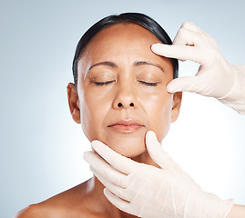 Image showing Botox, mature woman and doctor hands check face for plastic surgery and beauty consultation. Skincare, beauty and facial change for medical and aesthetic transformation with dermatology and filler