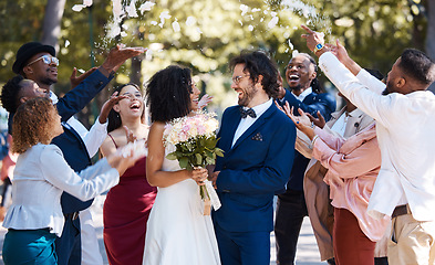 Image showing Confetti, wedding couple and marriage celebration of crowd throwing flower petals outdoor. Happiness, excited and social event with bride and man laughing from love and congratulations applause