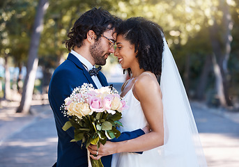 Image showing Married couple, flower bokeh and smile for commitment, marriage or love together in the park. Happy groom and bride smiling in happiness for honeymoon, romance and embracing relationship in nature