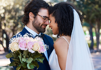 Image showing Married couple, flower and forehead with smile for wedding, marriage or loving commitment in the park. Happy groom and bride smiling in happiness for honeymoon, romance and embracing relationship