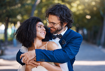 Image showing Love, wedding and happy couple outdoor for marriage celebration event together with support. Interracial bride and groom at park with trust, partnership and a hug for commitment and care with a smile