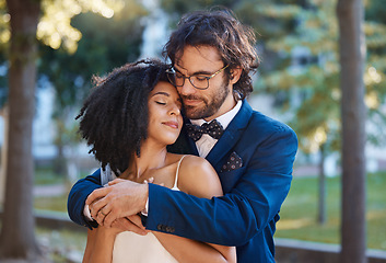 Image showing Wedding, couple and hug of love outdoor for marriage celebration event together with support. Interracial man and woman at nature park with trust, partnership and commitment or safety and security