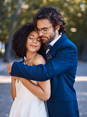 Image showing Interracial wedding, black woman and man with hug with smile, happiness or future together. African bride, husband and diversity at outdoor marriage for love, embrace or eye contact in sunshine