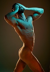 Image showing Nude, body and muscular with a dramatic man in studio on a dark background for art or self expression. Fitness, naked and hands covering face with a male model posing for health, wellness or artwork