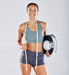 Image showing Black woman, portrait and scale for wellness, diet and exercise for weight loss and healthcare with grey studio background. Fitness, Jamaican lady and female with measuring tape, balance and mindset